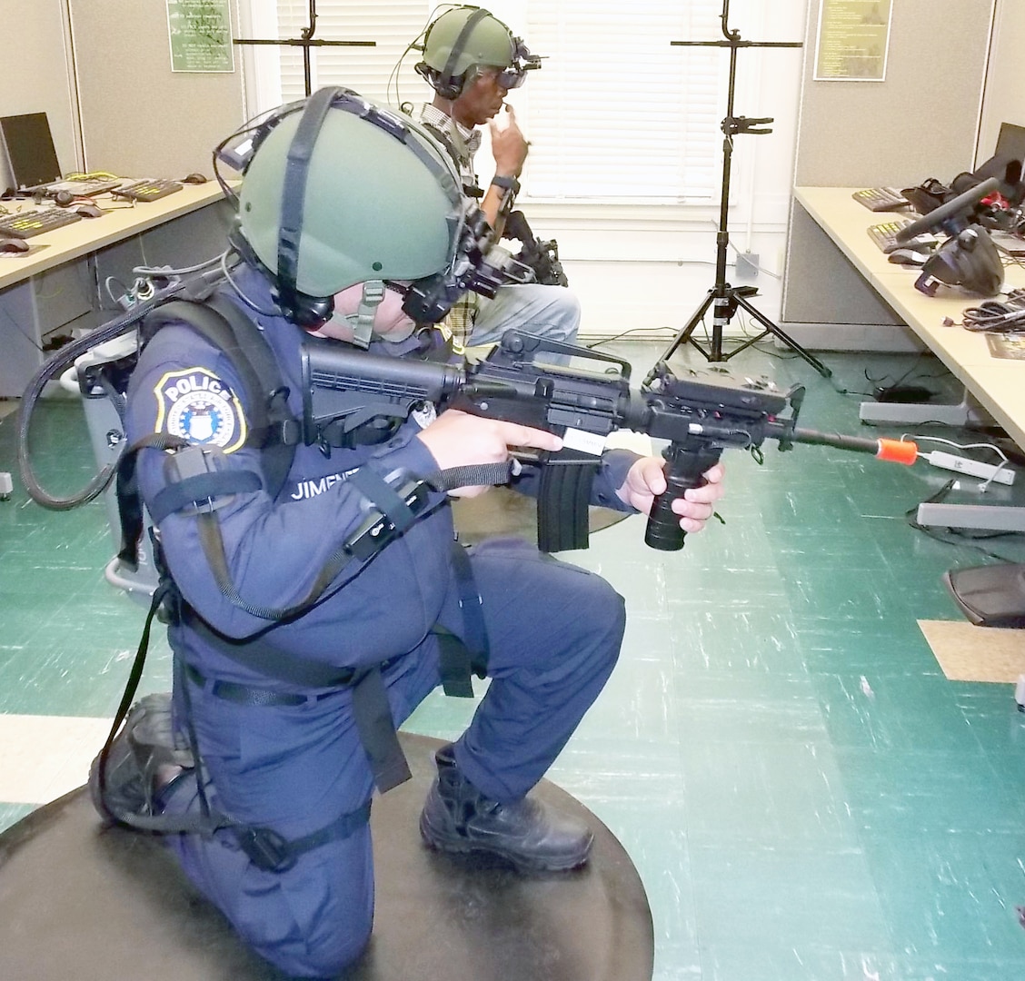 Oscar Jimenez, a police officer with the 502nd Security Forces Squadron at JBSA-Fort Sam Houston, and Cedric Williams engage in virtual active shooter training.
 (Army Photo Courtesy of HHC, Southern Training Division 75th Training Command)