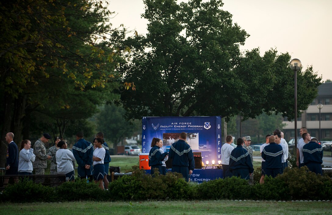 .Participants and spectators at the Joint Base Andrews' Energy Action Month 5K Fun Run gather near the event display Oct. 15, 2013. (U.S. Air Force photo/Master Sgt. Jeffery Allen)