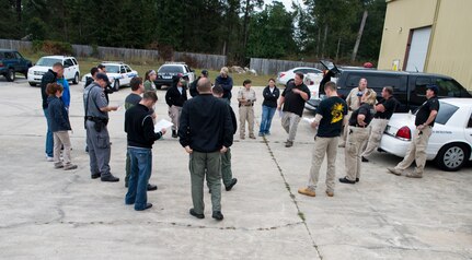 Federal agencies get briefed October 22, 2013 before taking part in Explosives detection training in Summerville, S.C. During this training, the dogs undergo obstacles where they searched through blocks or warehouse equipment for substances that are and may be used by terrorist or people who would like to harm us in the United States. (U.S. Air Force/Senior Airman Ashlee Galloway)