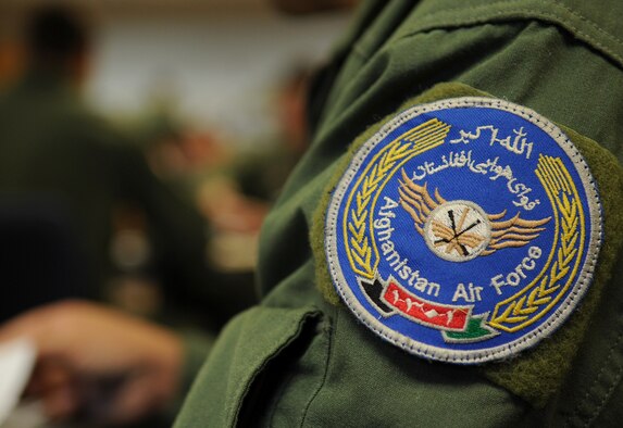 Afghanistan Air Force Lt. Col. Aimal Sayedi Pacha, pilot, prepares for his first flight in a C-130 during training with the 62nd Airlift Squadron Sept. 3, 2013, at Little Rock Air Force Base, Ark. Pacha and Lt. Khial Shinwari, the first two Afghan C-130 pilots, began their training and in-processing with the 714th Training Squadron here. (U.S. Air Force photo by Staff Sgt. Caleb Pierce)