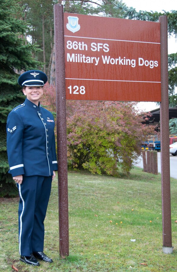 A1C Melissa Lackore sings the U.S. and German National Anthems for the 86 Security Forces retirement and memorial service for four military working dogs. SrA Sarah Kilgore ended the ceremony by reading a poem “Guardians of the Night.”