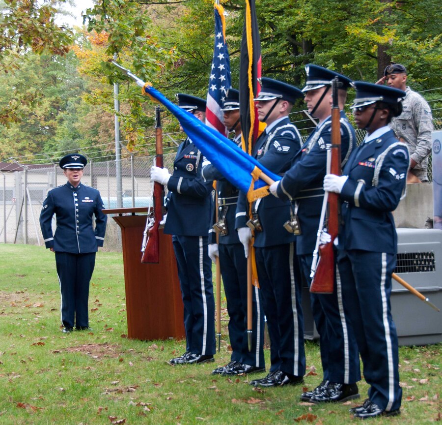 A1C Melissa Lackore sings the U.S. and German National Anthems for the 86 Security Forces retirement and memorial service for four military working dogs.  Being an animal lover herself, A1C Lackore said in an interview: “It was an absolute honor to have the opportunity to perform for often unrecognized heroes in our military.  I have such admiration for everything that the military working dogs and their handlers do to protect our nation.”