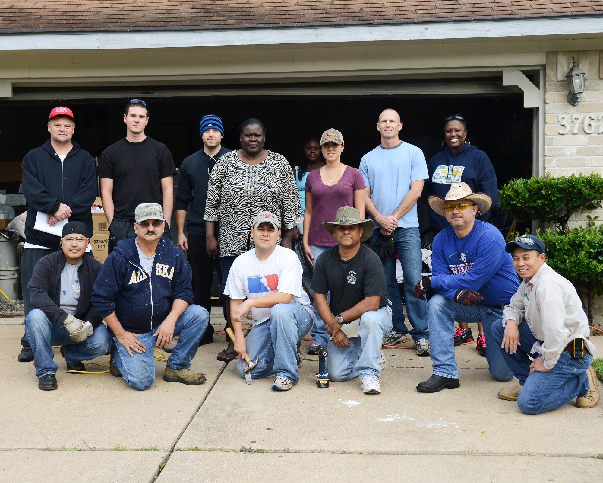 Members of the 147th Reconnaissance Wing that have volunteered their time and skills to make emergency critical repairs to a Vietnam Veteran's home. The Airmen teamed up with Rebuild Together Houston to make the repairs. National Guard photo by Master Sgt. Sean Cowher