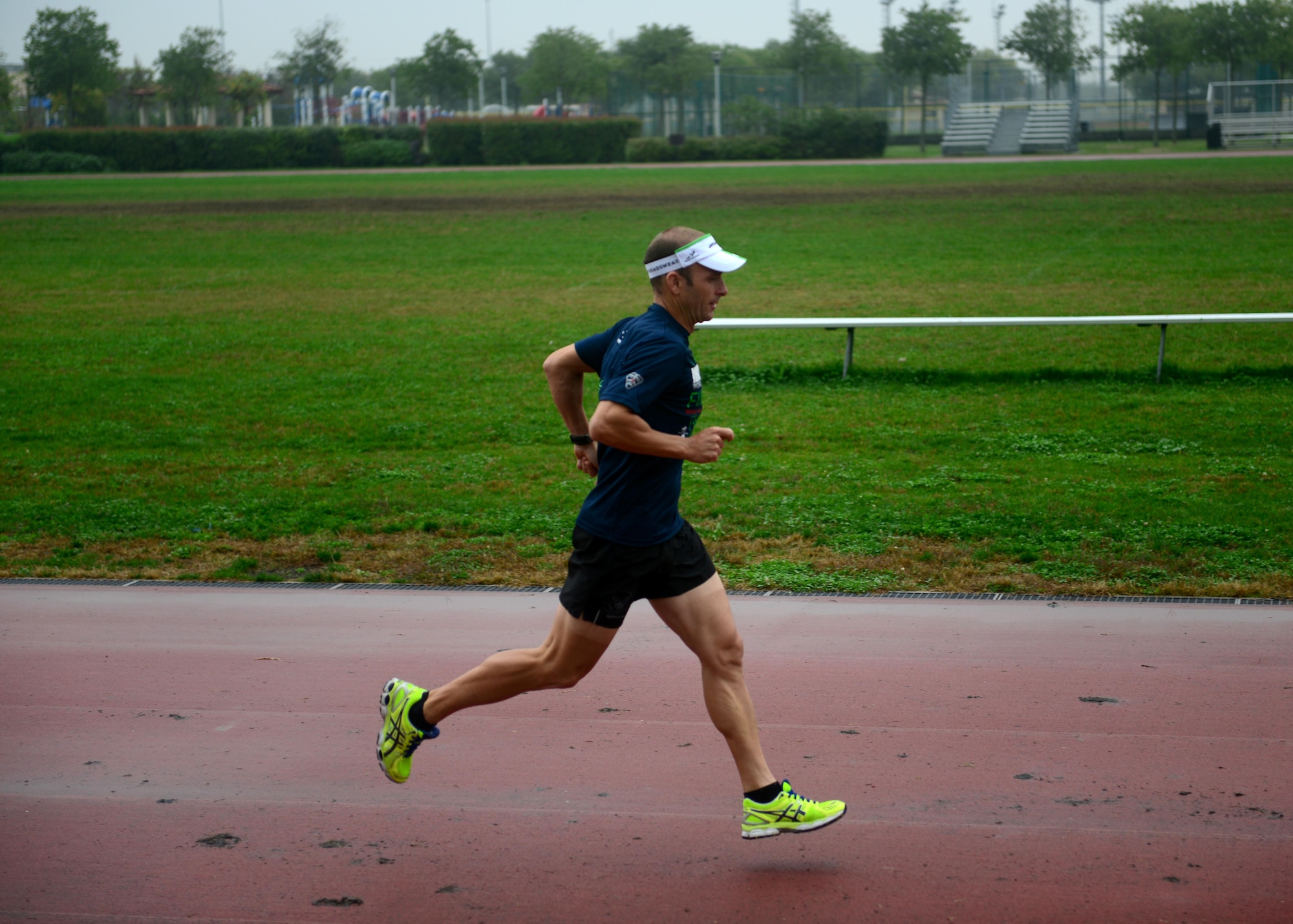 Lt. Col. Scott Poteet, 31st Operations Group deputy, runs on the track Oct. 23, 2013, at Aviano Air Base, Italy.   Poteet recently completed the 2013 Ironman World Championship in Kailua-Kona, Hawaii, where he ranked 343 out of 2,134 participants. (U.S. Air Force photo/Staff Sgt. Evelyn Chavez)