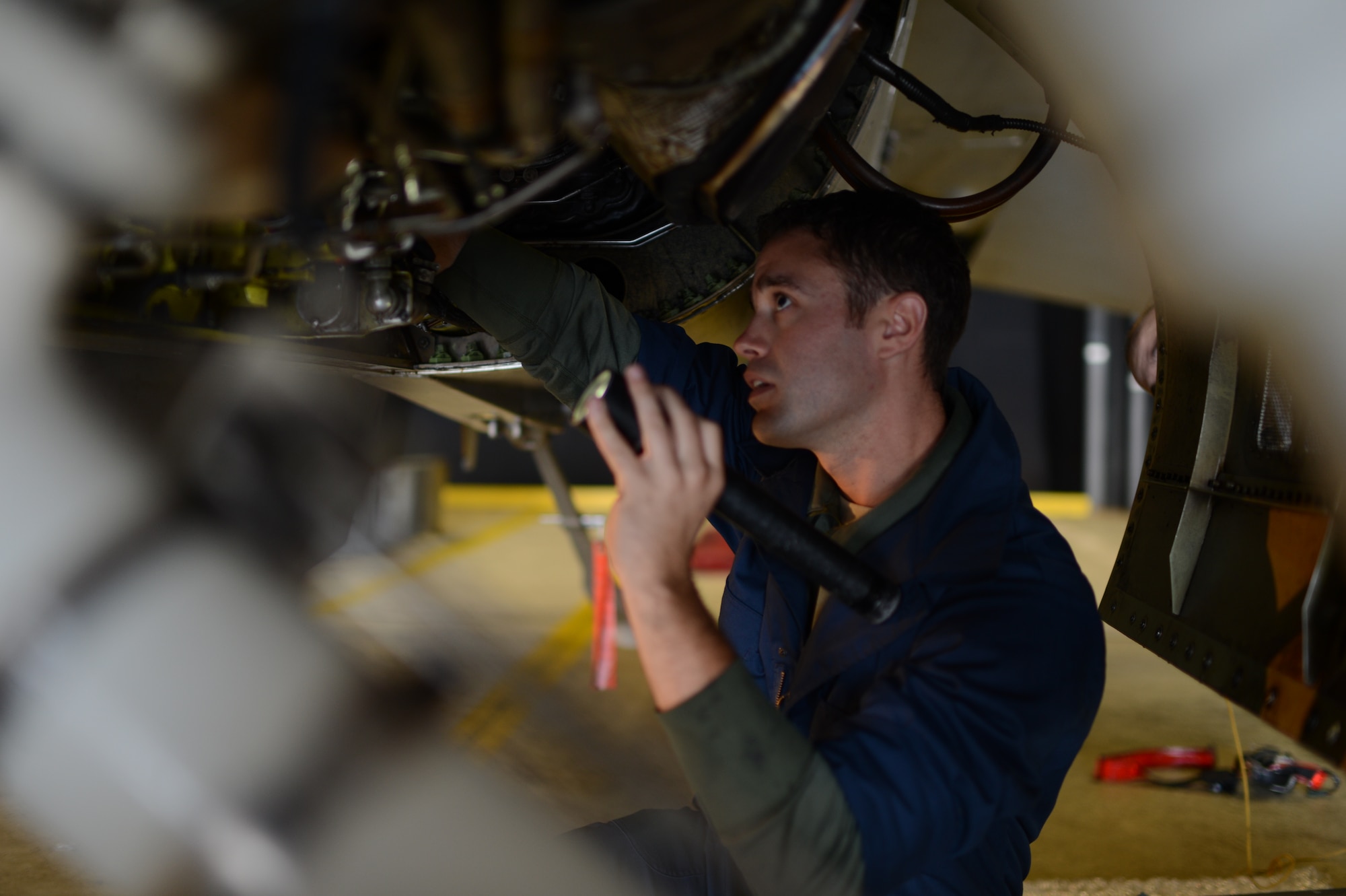 SPANGDAHLEM AIR BASE, Germany – U.S. Air Force Tech. Sgt. Brandon Fontaine, 480th Aircraft Maintenance Unit cannibalization manager from Erie, Pa., installs a power take-off shaft on an F-16 Fighting Falcon fighter aircraft during a cannibalization rebuild Oct. 22, 2013. The power take-off shaft is used to power engine accessories. (U.S. Air Force photo by Airman 1st Class Gustavo Castillo/Released) 