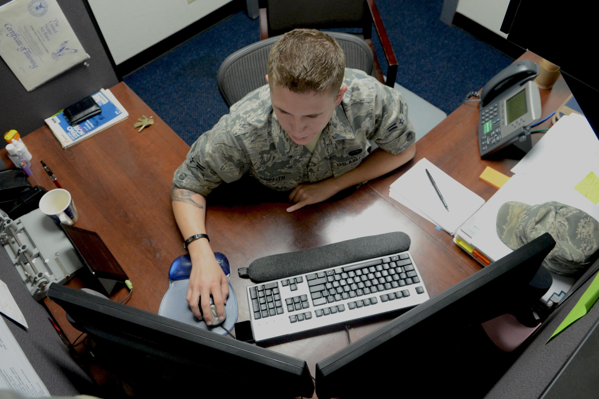 Airman 1st Class Presley Griffith, 36th Communications Squadron’s Knowledge Operations Flight base staging manager, updates the records custodian training list Sept. 27, 2013, on Andersen Air Force Base, Guam. The Knowledge Operations Flight Airmen oversee six programs, including the base’s intranet website, evaluation management system and Privacy Act information. (U.S. Air Force photo by Airman 1st Class Emily A. Bradley/Released)