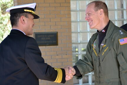 BELLEVUE, Neb. (Oct. 24, 2013) Japan Maritime Self Defense Force (JMSDF) Rear Adm. Hiroshi Yamamura, Deputy Chief of Staff for Defense Plans and Policy for the Ministry of Defense Joint Staff, is greeted by U.S. Strategic Command (USSTRATCOM) director of global operations Rear Adm. John R. Haley, upon Yamamura&#039;s arrival to USSTRATCOM.  USSTRATCOM personnel provided Yamamura an overview of missions, capabilities, and deterrence responsibilities through a two-day series of discussions and office calls. (U.S. Navy photo by Mass Communication Specialist 1st Class Byron C. Linder/Released)