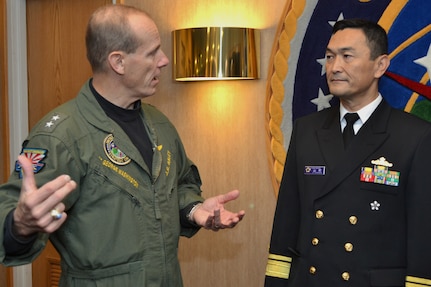 BELLEVUE, Neb. (Oct. 24, 2013) U.S. Strategic Command (USSTRATCOM) director of global operations Rear Adm. John R. Haley speaks with Japan Maritime Self Defense Force (JMSDF) Rear Adm. Hiroshi Yamamura, Deputy Chief of Staff for Defense Plans and Policy for the Ministry of Defense Joint Staff, during  Yamamura&#039;s visit to USSTRATCOM.  USSTRATCOM personnel provided Yamamura an overview of missions, capabilities, and deterrence responsibilities through a two-day series of discussions and office calls. (U.S. Navy photo by Mass Communication Specialist 1st Class Byron C. Linder/Released)