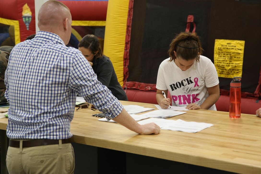 Marine Special Operations Regiment hosted a Jane Wayne Day event, Oct. 19, 2013, on Camp Lejeune, N.C.  Wives of U.S. Marine Corps Forces, Special Operations Command personnel participated in the event, experiencing firsthand how Marines with MARSOC train for missions. This Jane Wayne Day event immersed participants in an interactive scenario comprising patrols, a run through an obstacle course, rides on zodiac boats, encounters with role-players and a simulated raid on a town.  MARSOC Marines supervised the entire event, and assisted the family members throughout the scenario. (U.S. Marine Corps Photo by Lance Cpl. Steven Fox/Released)