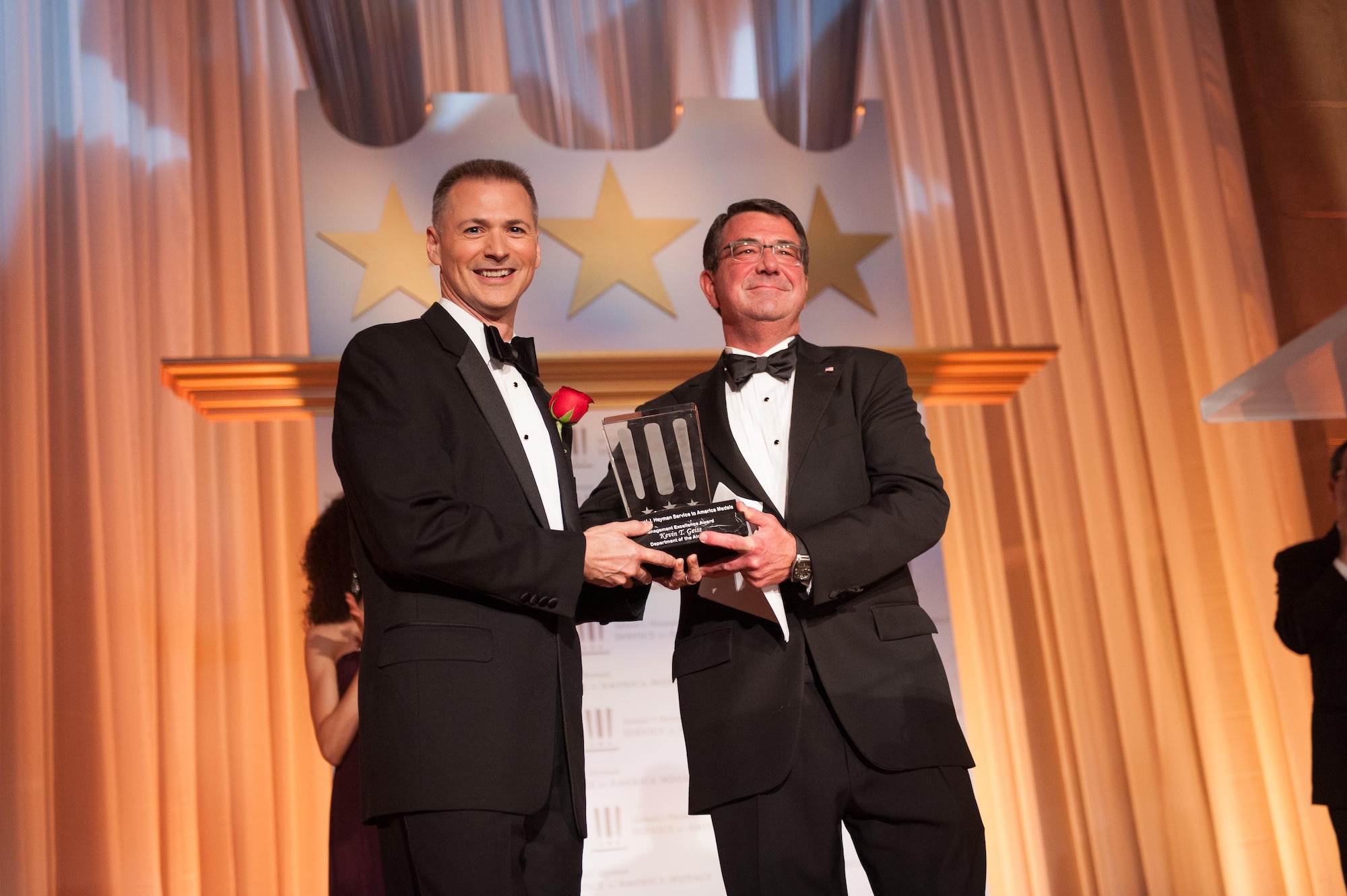 Department of the Air Force's Kevin Geiss (left) receives the 2013 Service to America Management Excellence Medal from Department of Defense Deputy Secretary Ashton Carter, Oct. 3, 2013 at the Andrew W. Mellon Auditorium in Washington, D.C. (Courtesy photo/Sam Kittner)
