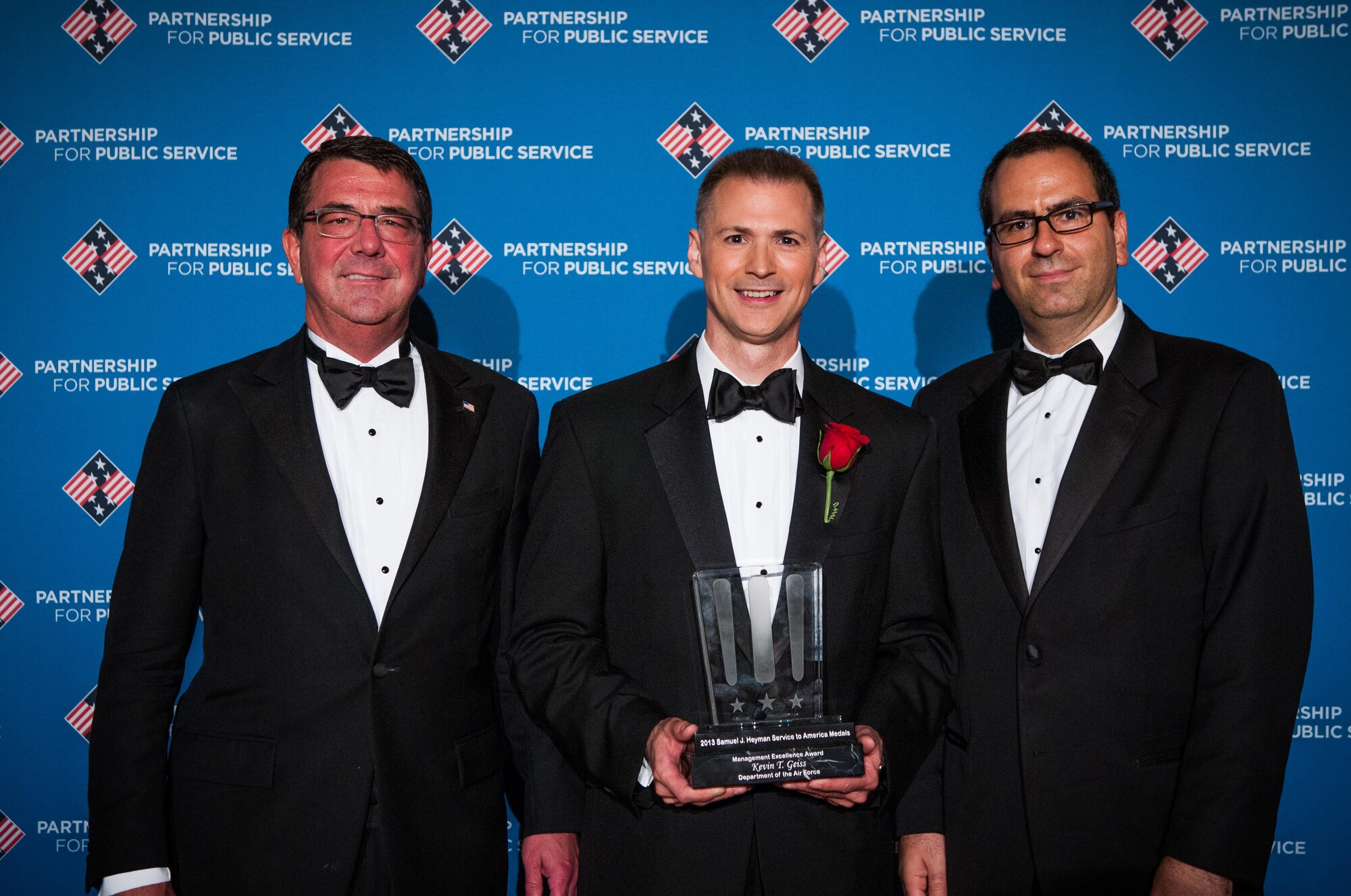 Department of Defense Deputy Secretary Ashton Carter (left), 2013 Service to America Management Excellence Medal recipient Kevin Geiss, and Boston Consulting Group's Roland Kastoun at the 2013 Samuel J. Heyman Service to America Medals awards dinner, held Oct. 3, 2013, at the Andrew W. Mellon Auditorium in Washington, D.C. (Courtesy photo/Sam Kittner)
