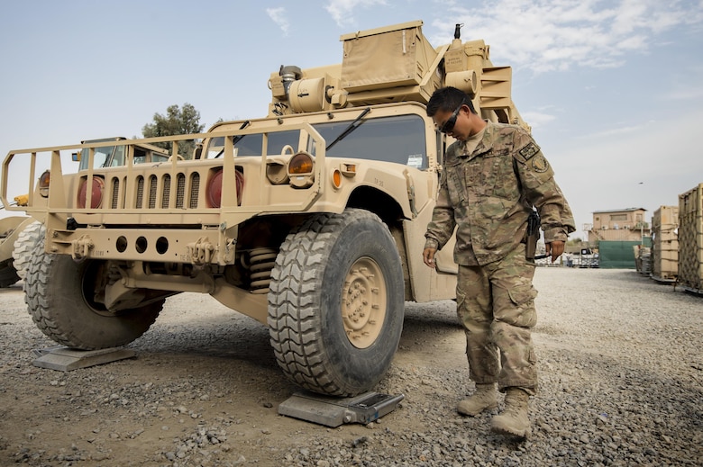 Senior Airman Leah Johnson checks the weight of a vehicle scheduled for shipping Sept. 22, 2013, at Forward Operating Base Salerno, Khost Province, Afghanistan. The 19th Movement Control Team a small squadron of Air Force surface movement controllers and aerial porters, oversee the vast majority of retrograde operations at FOB Salerno. Johnson, a St. Paul, Minn. native, is deployed from Travis Air Force Base, Calif. Johnson is a 19th MCT aerial porter, (U.S. Air Force photo/Master Sgt. Ben Bloker)
