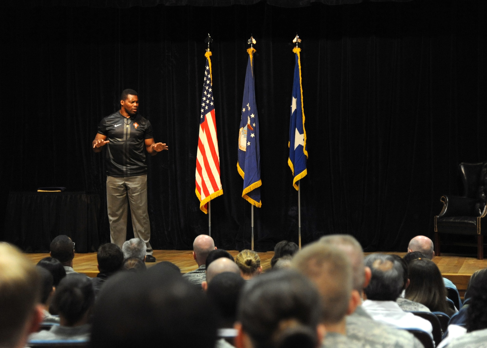 Herschel Walker speaks to more than 200 personnel from the 59th Medical Wing Oct. 23, 2013, at the Wilford Hall Ambulatory Surgical Center, Joint Base San Antonio-Lackland, Texas. As part of the Department of Defense Patriot Support Program’s Anti-stigma campaign, Walker visits military installations across the country to encourage service members to seek help for mental health and substance abuse issues. 