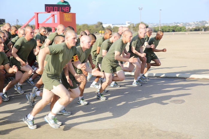 Company F recruits take off to begin the running portion of their final Physical Fitness Test Oct. 10. The running portion of the PFT is a timed event and totals a distance of 3 miles. Co. F also had to complete a maximum set of pull-ups and timed crunches.