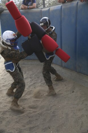 Recruits of Company L, 3rd Recruit Training Battalion, bout each other in a simulated hand-to-hand combat fight during Pugil Sticks III aboard the depot, Oct. 8. Recruits learn different traits such as discipline during pugil sticks.