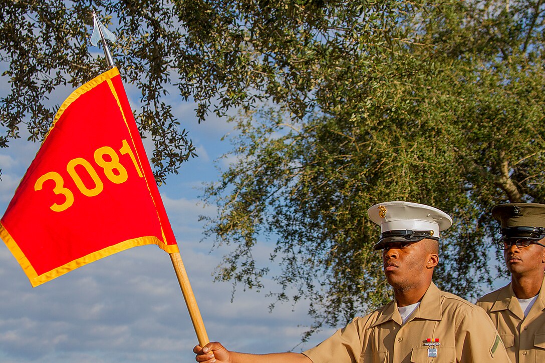 Pfc. Isiah Carter, honor graduate for platoon 3081, stands at parade rest before graduation aboard Parris Island, S.C., Oct. 25, 2013. Carter, native of Memphis, Tenn., was recruited by Sgt. Darryl Greenwood, recruiter from Recruiting Substation Germantown, Recruiting Station Nashville. Carter will be able to enjoy some much deserved leave with his family as he prepares for Marine Combat Training in Camp Geiger, N.C. (U.S. Marine Corps photo by Lance Cpl. John-Paul Imbody)