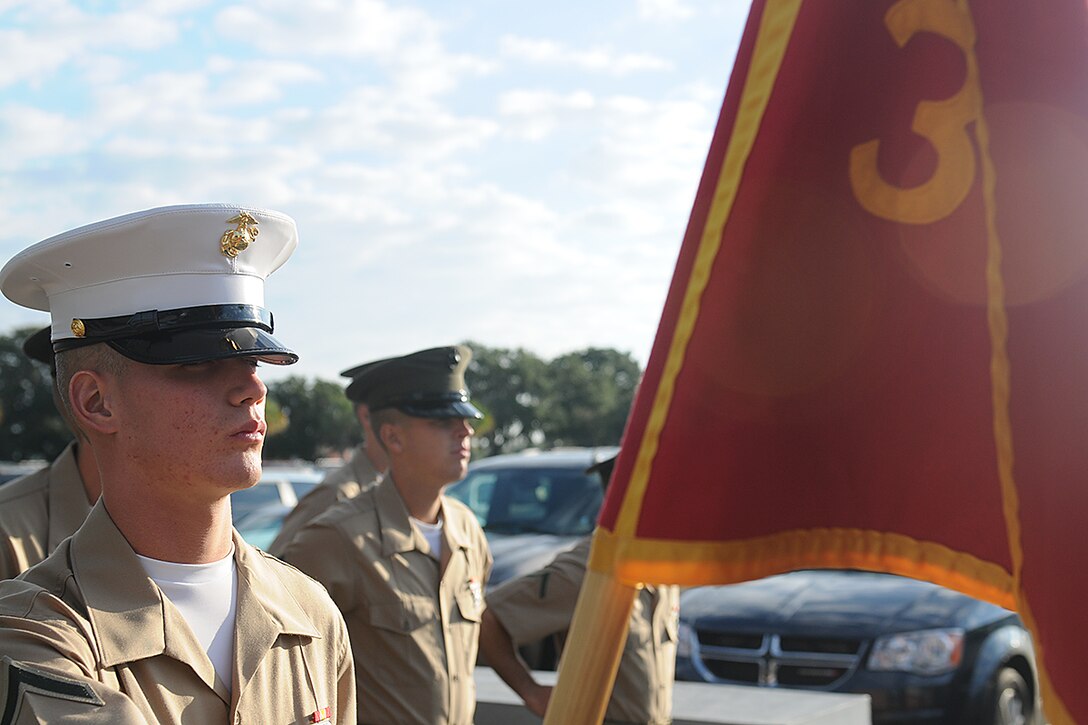 Pfc. Nicholas Adams, honor graduate for platoon 3080, stands at parade rest before graduation starts aboard Parris Island, S.C., Oct. 25, 2013. Adams, a native of Adairsville, Ga., was recruited by Staff Sgt. Donald Hall, recruiter from Recruiting Substation Cartersville, Recruiting Station Atlanta. Adams will be able to enjoy some much deserved leave with his family as he prepares for Marine Combat Training in Camp Geiger, N.C. (U.S. Marine Corps photo by Lance Cpl. Stanley Cao)
