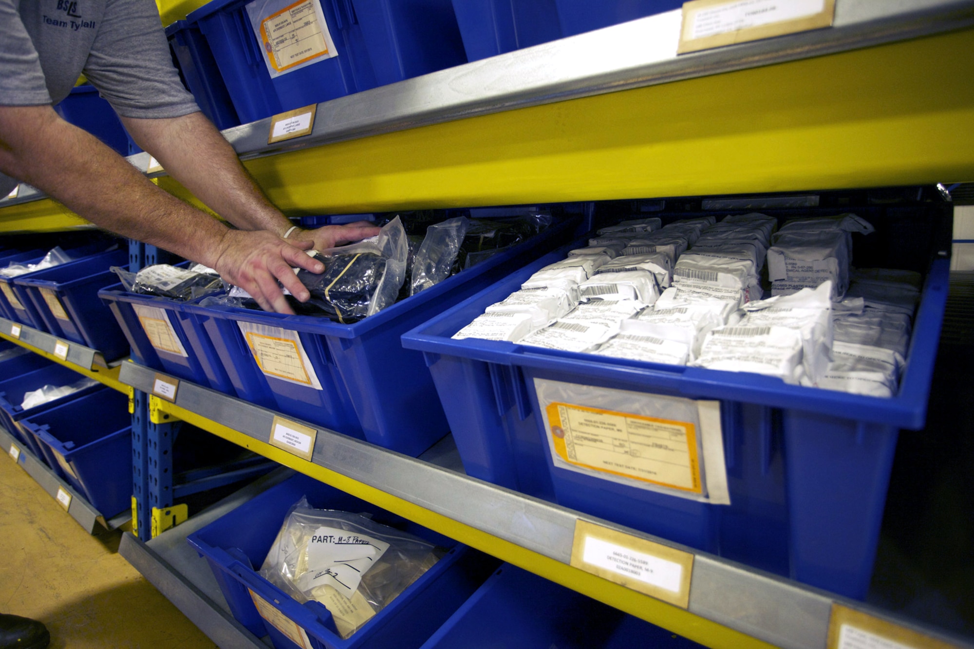 Kenneth Vanderipe, individual protective equipment warehouse technician stocks chemical protective overboots at the 325th Logistics Readiness Division here. Equipment like overboots are stored to be used in deployable chemical warfare bags with an assigned expiration date based on expected shelf-life. Equipment experts in the Air Force Civil Engineer Center Readiness Directorate’s Emergency Management Division are working with other services to test, evaluate and extend the service life of useful equipment. 