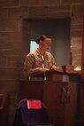 Sgt. Amanda King, a survivor of domestic violence, shares her story of survival during a candlelight vigil held to remember the victims of domestic violence and raise awreness at the Marine Corps Air Station New River chapel, Oct. 17.