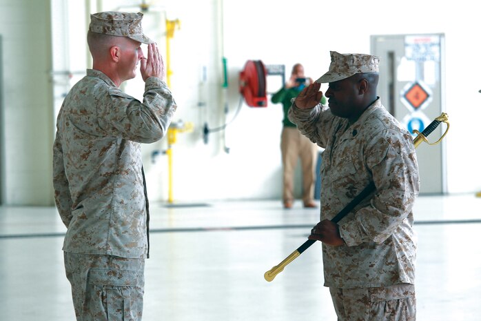 Sgt. Maj. Michael Diggs salutes Col. Michael Orr during his releif and appointment ceremony, at the Marine Medium Tiltrotor Squadron 204 hangar, Oct. 11. Diggs, handed the responsibilities as senior enlisted advisor to Sgt. Maj. Clive O'Conner. Diggs retired from the Marine Corps after 30 years of honorable service.