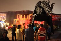 A large beast stands guard at the entrance of the Panic Attack haunted attraction. Panic Attack is one of North Carolina's largest, yearly haunted houses, and is located in close proximity to Marine Corps Base Camp Lejeune and Marine Corps Air Station New River.