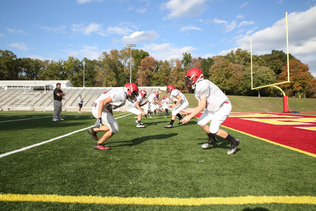 The Quantico Warriors practice football drills aboard Marine Corps Base Quantico on Oct. 24, 2013. The Warriors beat the Rappahannock County High School Panthers on Oct. 18, securing the highest scoring season since 2010.