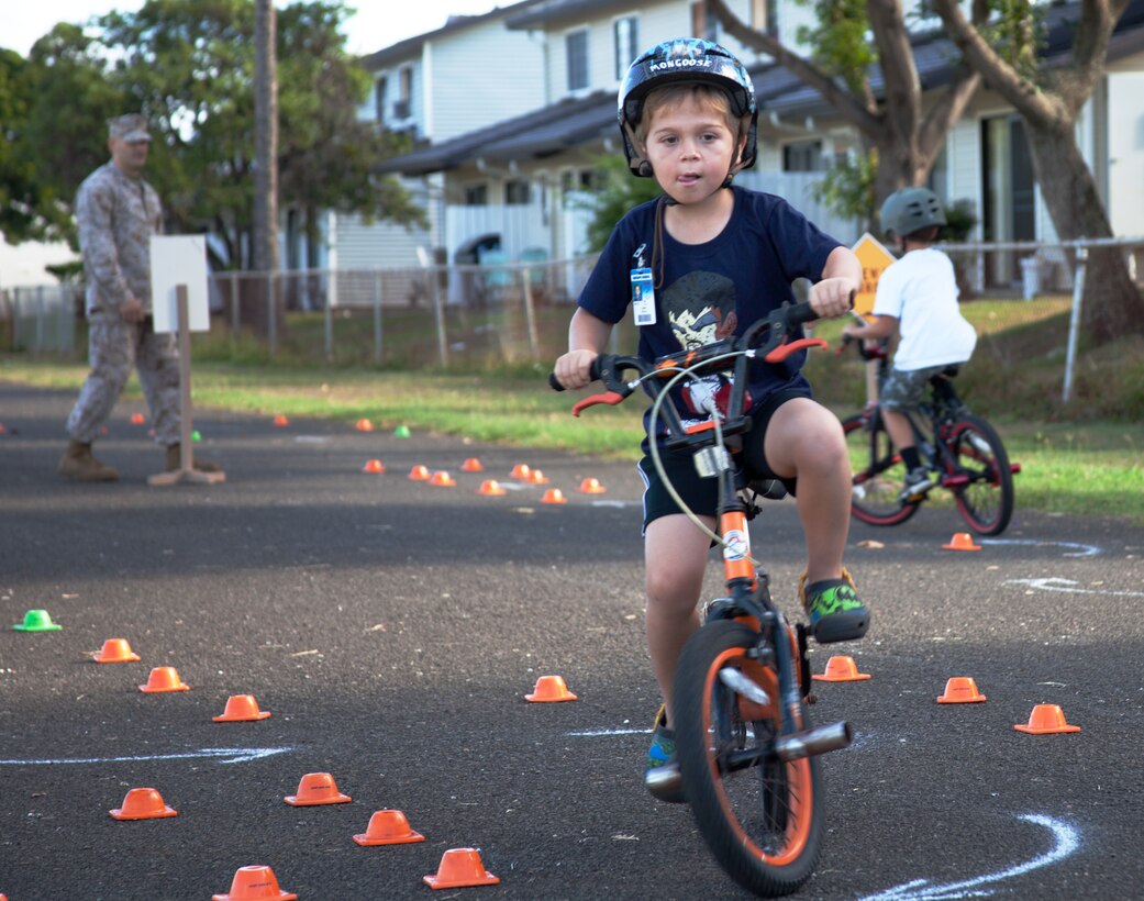 Grant Wilkerson, a student at Mokapu Elementary, turns through corners during the Bike Rodeo at Mokapu Elementary School’s parking lot, Oct. 23, 2013.(Official U.S. Marine Corps photo by Lance Cpl. Nathan Knapke) 