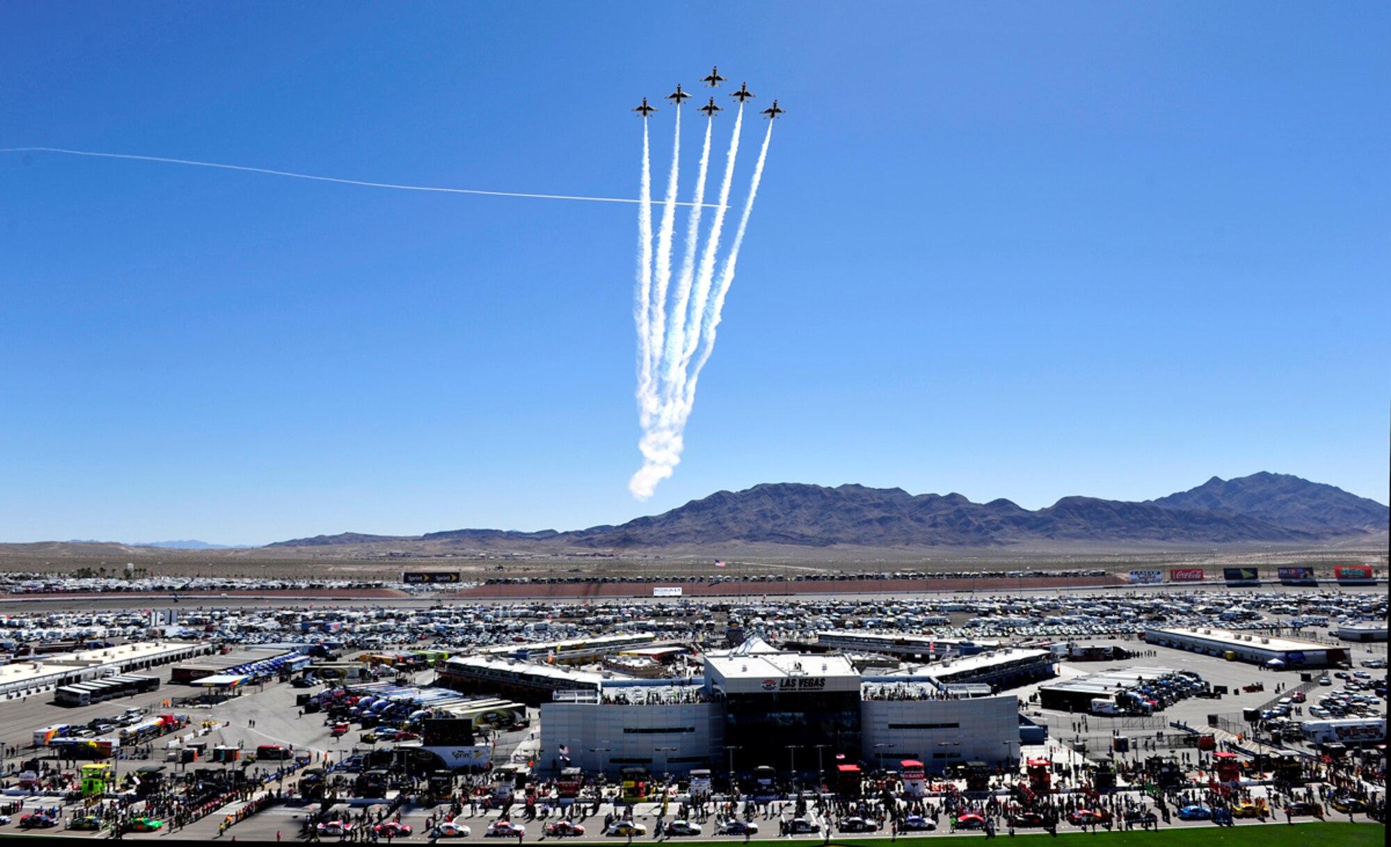 The Air Force Thunderbirds fly the six-ship Delta formation over the Las Vegas Motor Speedway to begin the start of the Kobalt Tools 400. 