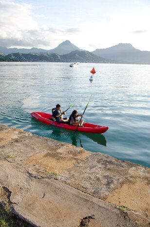 Stefania Pina (front), 10, and Juangel Pina, 12, go kayaking in Kaneohe Bay during the Marine Corps Base Hawaii Marina's open house, Oct. 19, 2013. The open house included pontoon rides to Coconut Island, kayaking, music and food. (U.S. Marine Corps photo by Kristen Wong)
