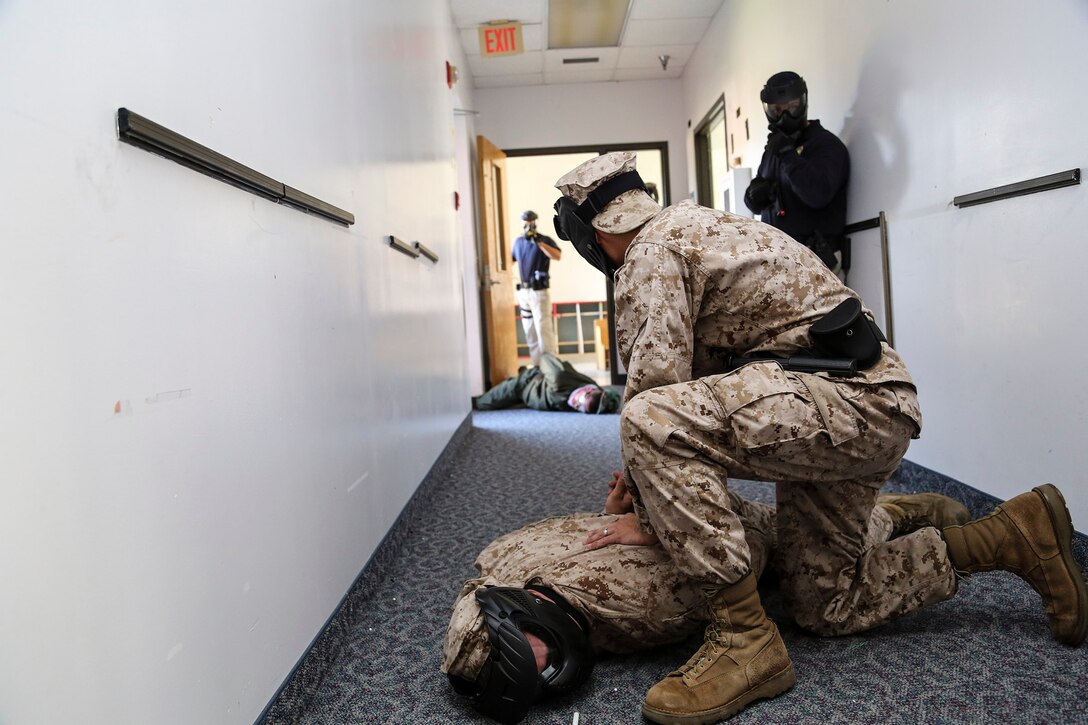 Marines with the Provost Marshal's Office aboard Marine Corps Air Station Beaufort conduct active shooter training aboard Marine Corps Recruit Depot Parris Island, Oct. 15. To make training realistic they used airsoft pistols, handcuffs, fake pepper spray and fake electroshock weapons to suppress the shooter.