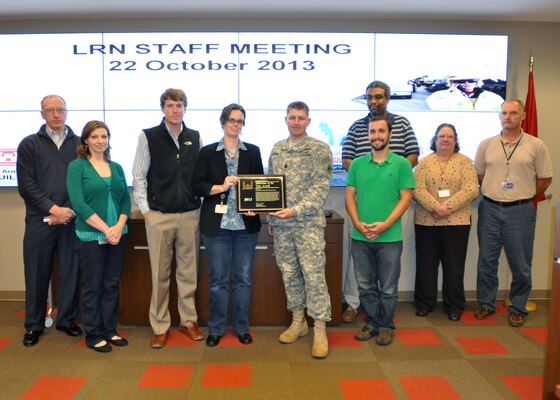 Lt. Col. John L. Hudson, Nashville District commander presents the 2013 USACE Innovation of the Year Award to a team of engineers and geologists from the U.S. Army Corps of Engineers Nashville District Civil Design and Construction Branch. The Wolf Creek team is comprised of Mike Zoccola, Sarah Wiles, Joshua Bomar, Vanessa Bateman, Lt. Col. John L. Hudson, Alex King, Baron Worsham, Emily Carr and Mike Brown. Not pictured are: Terry Penny, and Brook Brosi.   
