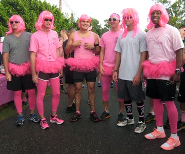 Members of Joint Task Force-Bravo show off their pink outfits during the first-ever Soto Cano Air Base "Fight Against Breast Cancer" six-kilometer run, Oct. 25, 2013.  The event was organized by the 612th Air Base Squadron, and raised more than $1,000 in funding that was donated to breast cancer research through the Combined Federal Campaign.  (U.S. Air Force photo by Capt. Zach Anderson)