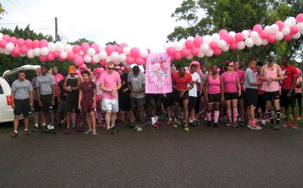 Members of Joint Task Force-Bravo line up at the start of the first-ever Soto Cano Air Base "Fight Against Breast Cancer" six-kilometer run, Oct. 25, 2013.  The event was organized by the 612th Air Base Squadron, and raised more than $1,000 in funding that was donated to breast cancer research through the Combined Federal Campaign.  (U.S. Air Force photo by Capt. Zach Anderson)