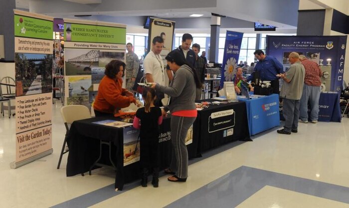 Representatives from several energy companies and the 75th Civil Engineer Squadron give out information to passers-by at Hill's Energy Awareness Fair held Oct. 9 at the Base Exchange. (U.S. Air Force photo by Alex R. Lloyd/Released)