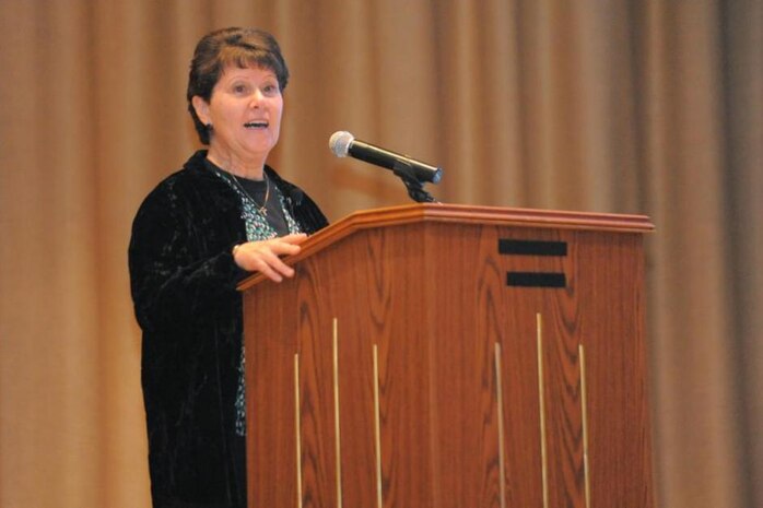 Dianne Ingle, R.N., Flight Medicine Clinic nurse, speaks at a seminar on breast and prostate cancer at the Base Theater on Oct. 22. She has a unique perspective on breast cancer as a survivor and as a health care provider. (U.S. Air Force photo byTodd Cromar/Released)