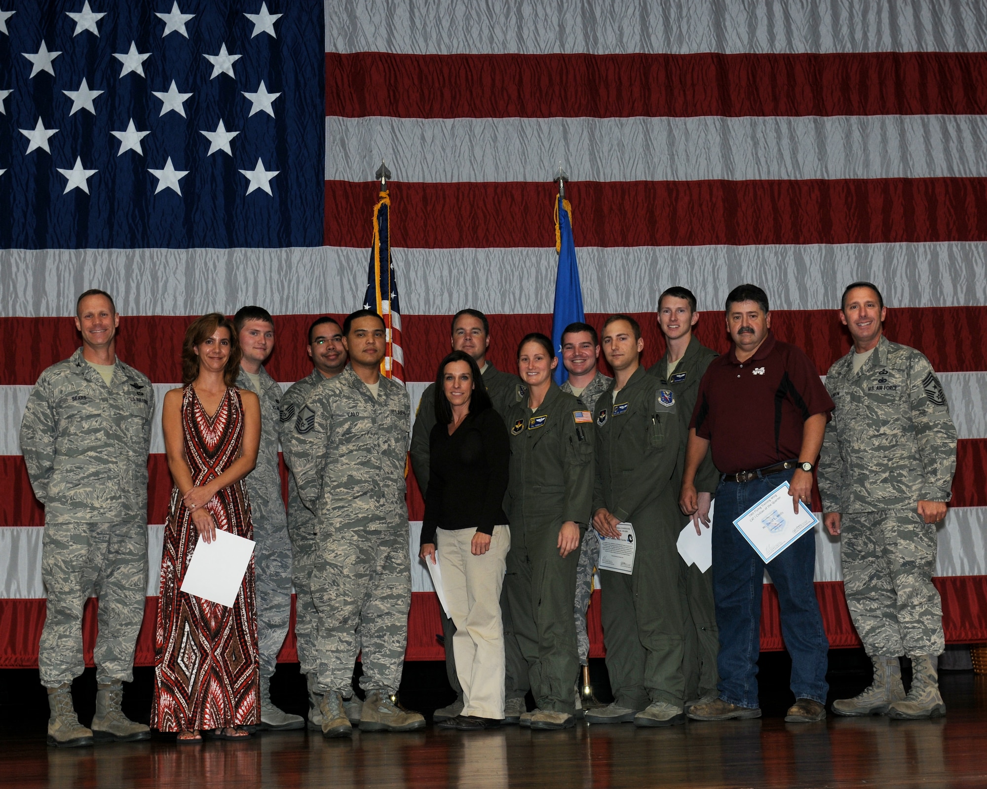 The 2013 third quarterly awards winners or their representatives pause for a photo on stage at Kaye Auditorium Oct. 22. (U.S. Air Force Photo/Melissa Doublin)
