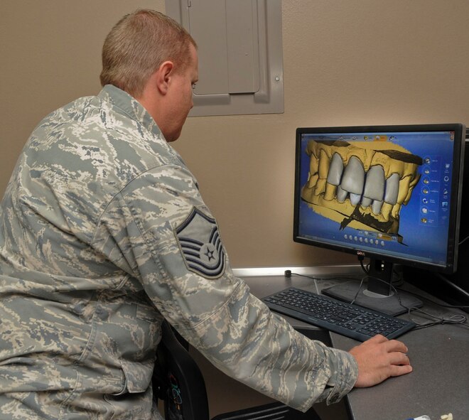 Master Sgt. Denny Shaffer, 2nd Dental Squadron laboratory technician, views a crown molding on a computer aided design machine on Barksdale Air Force Base, La., Oct. 22, 2013. The CAD is used to create a range of dental restorations including crowns, crown lays, veneers, inlays and onlays, fixed bridges, dental implant restorations and orthodontic appliances. (U.S. Air Force photo/Senior Airman Kristin High)
