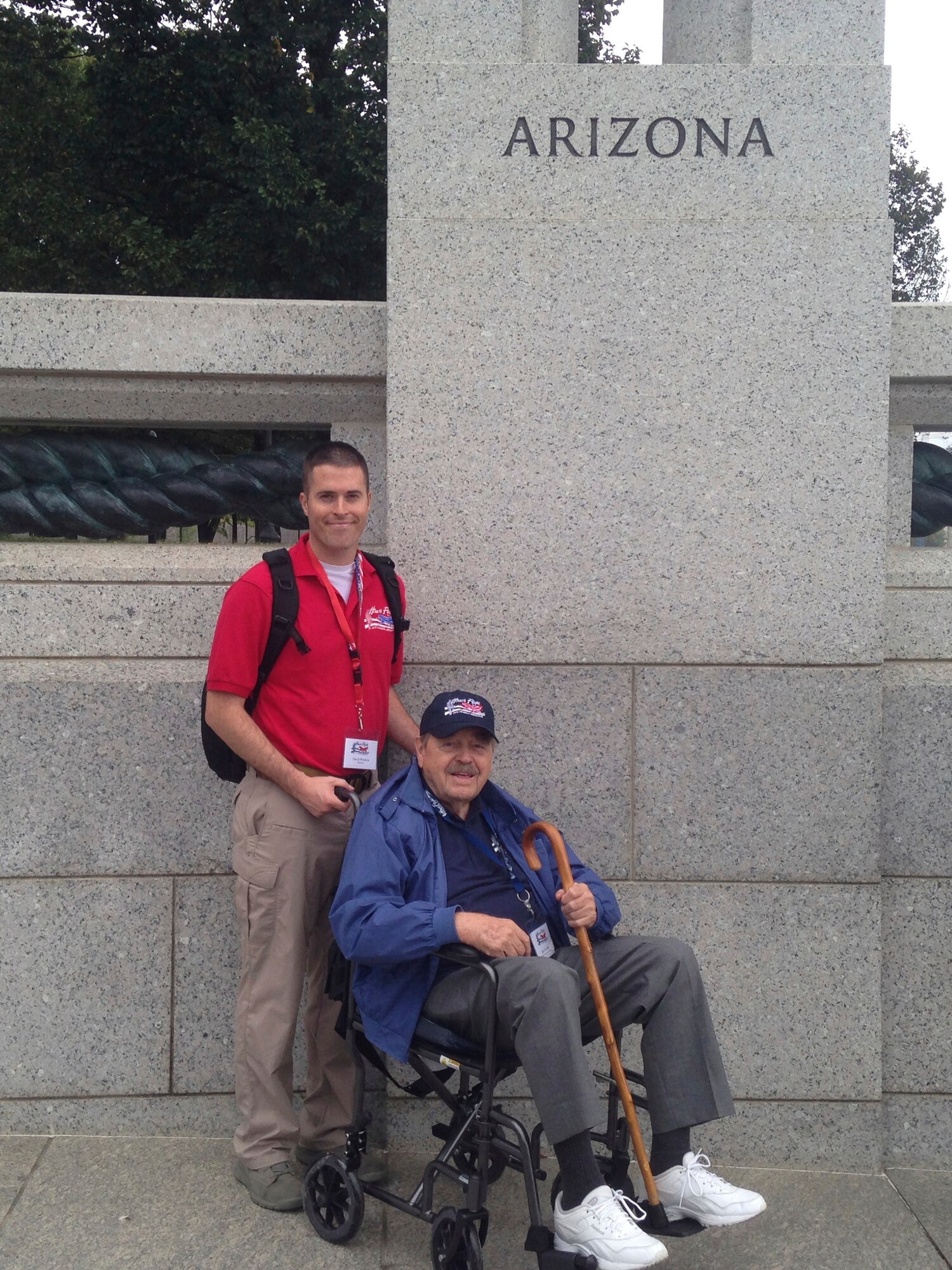 U. S. Air Force Staff Sgt. David Wilcken, 612th Air and Space Operations Center air tasking order production technician, and Robert Yeschek, a World War II, Korean War and Vietnam War veteran, pose at the World War II memorial in Washington D.C., Oct. 7, 2013. Wilcken flew with Yeschek during Honor Flight to be his guardian for the duration of the trip. (Courtesy photo)