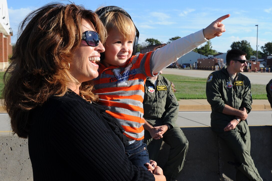 U.S. Air Force Capt. Michael Hayes, 27th Fighter Squadron systems weapons technician, holds his son Joseph Hayes after a six-month deployment to Kadena Air Base, Japan, at Langley Air Force Base, Va., Oct. 21, 2013. More than 300 Airmen were deployed in support of a Theater Security Package rotation where they provide stability and security while allowing units to integrate with U.S. and Japanese forces. (U.S. Air Force photo by Senior Airman Brittany Paerschke-O’Brien/Released)