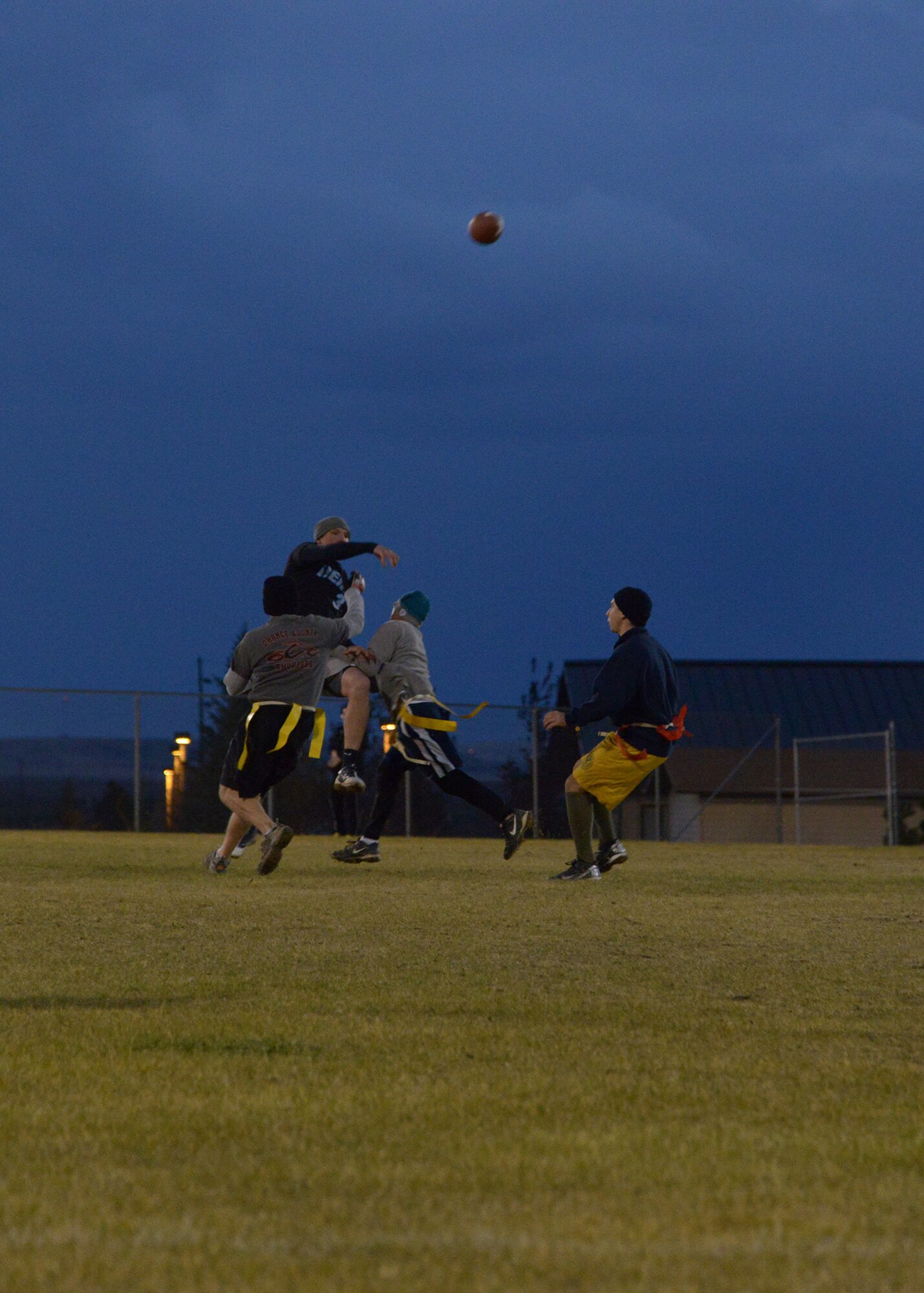 Airman 1st Class Brady Castellano, 341st Civil Engineer Squadron knowledge operator, throws a pass to his teammate during the second quarter of the 341st CES versus 341st Maintenance Group game Oct. 17. The final score of the game was 28 to 19 with the 341st MXG taking the win. (U.S. Air Force photo/ Airman 1st Class Collin Schmidt)