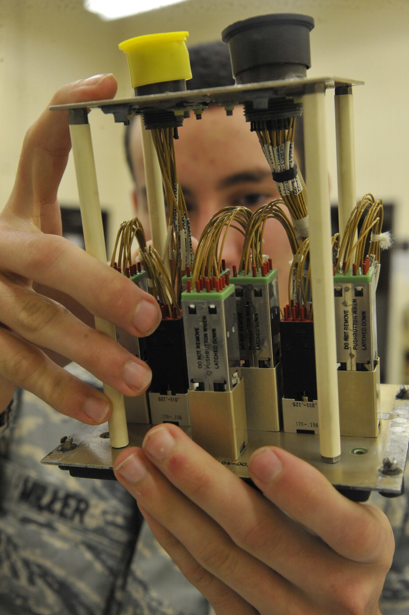U.S. Air Force Airman 1st Class Airman 1st Class Michael Miller, 509th Maintenance Squadron electrical environment technician, inspects a bleed-air control panel at Whiteman Air Force Base, Mo., Oct. 15, 2013. The bleed air control panel is used to control distribution of air throughout the B-2. (U.S. Air Force photo by Airman 1st Class Keenan Berry/Released)