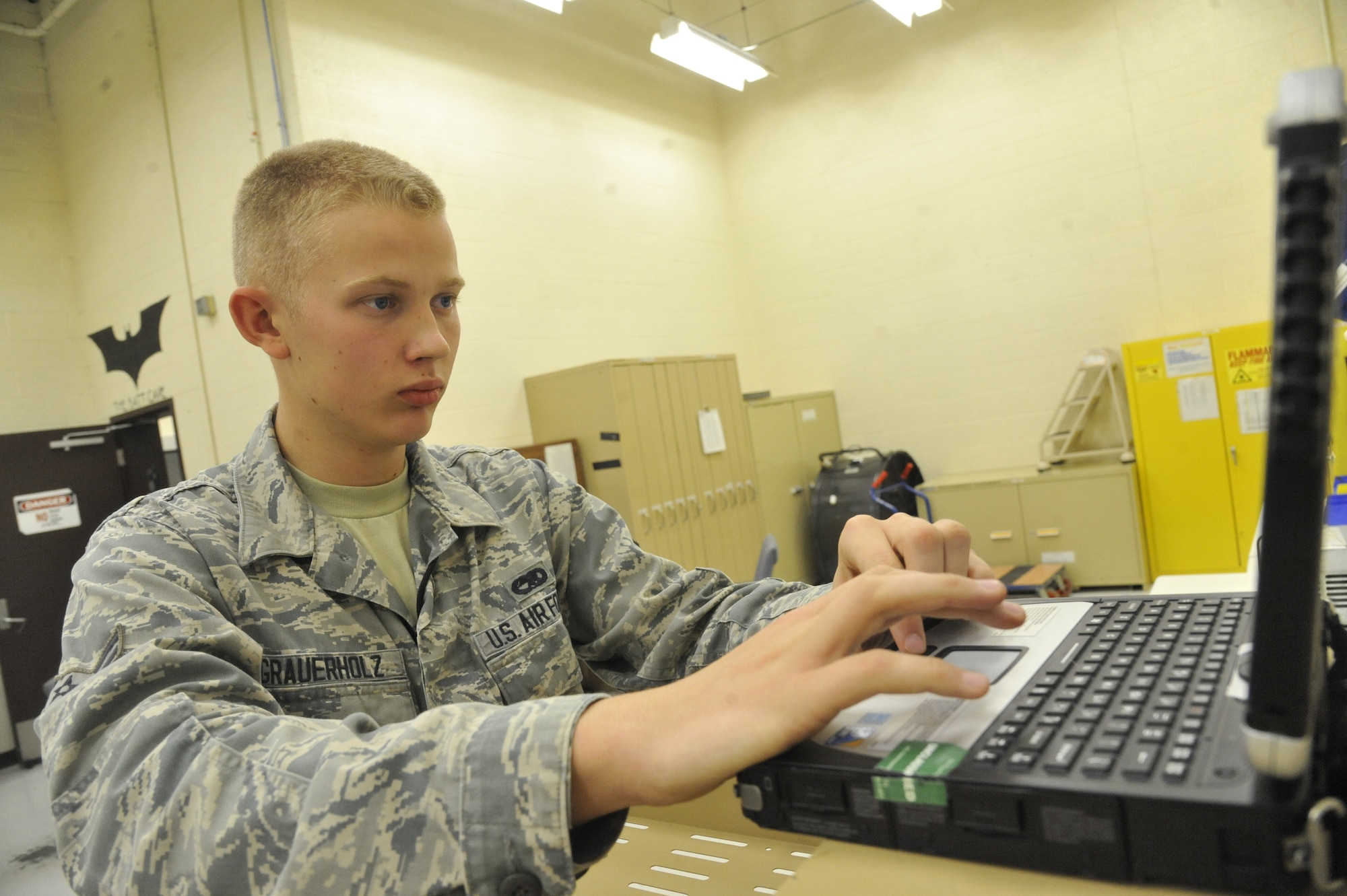 U.S. Air Force Airman 1st Class Chad Grauerholz, 509th Maintenance Squadron electrical environment technician, reads technical orders for bench checks at Whiteman Air Force Base, Mo., Oct. 15, 2013. Airmen perform bench checks on the B-2’s components to ensure there are no loose or damaged wires or any other defects. (U.S. Air Force photo by Airman 1st Class Keenan Berry/Released)
