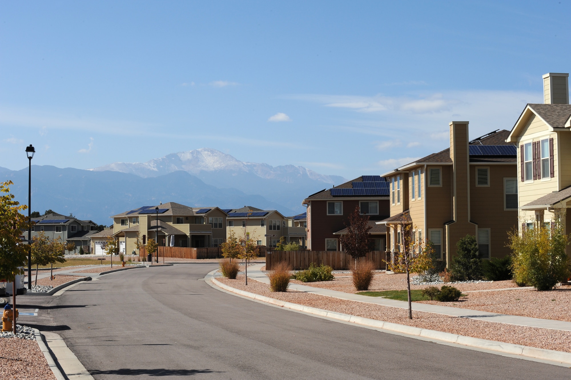 PETERSON AIR FORCE BASE, Colo. – Pikes Peak overlooks a row of homes on Peterson AFB complete with newly installed solar panels. The panels were installed as part of a 20-year lease that is expected to save more than $1.1 million in energy costs. These savings will provide additional funds for neighborhood improvements. (U.S. Air Force photo/Staff Sgt. Aaron Breeden)