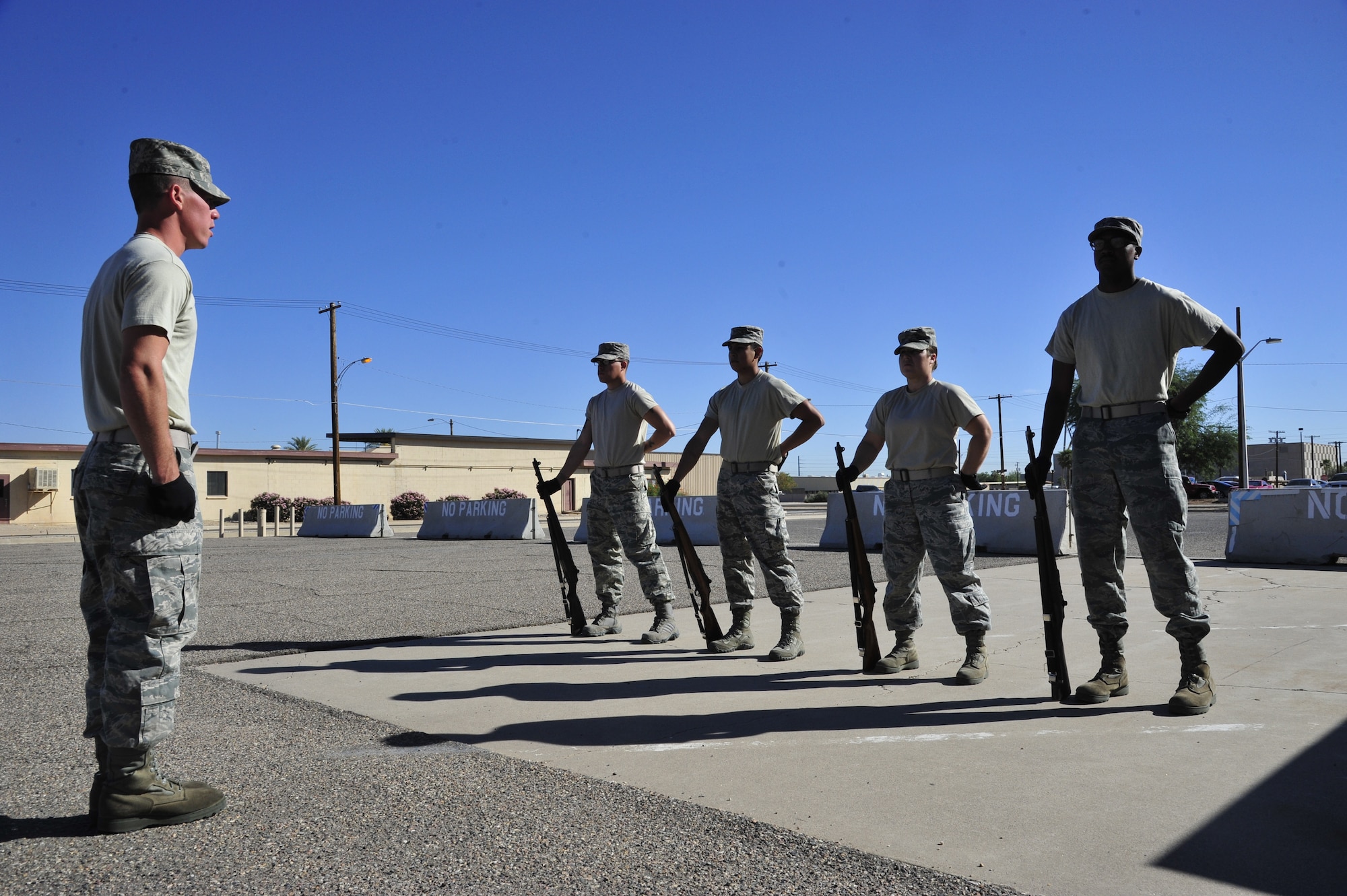 Airman 1st Class John Bowling, 56th Force Support Squadron B flight trainer, issues rifle commands to Honor Guard rookies Oct. 3 in their first month rotation. The rookies are learning the firing party sequence, which is used during funerals. (U.S. Air Force photo/Senior Airman Grace Lee)