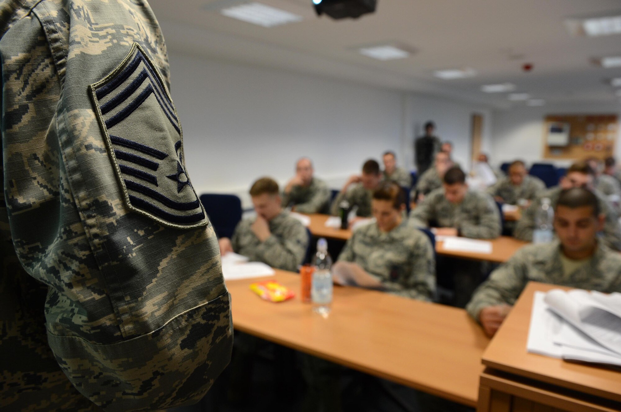 SPANGDAHLEM AIR BASE, Germany – U.S. Air Force Chief Master Sgt. Richard Lien, 52nd Civil Engineer Squadron fire chief, talks to Airmen during his weekly Chief’s Chat at one of the base’s fire stations Oct. 23, 2013. Chief’s Chat is a core group that allows Airmen to ask questions to leaders and talk about Air Force policies. (U.S. Air Force photo by Airman 1st Class Kyle Gese/Released)