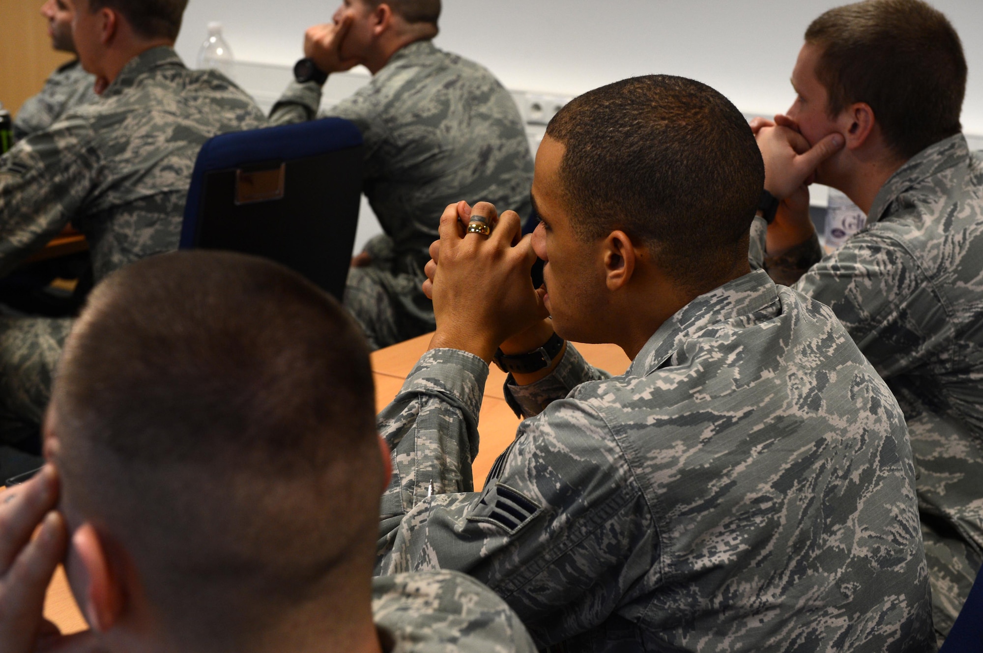 SPANGDAHLEM AIR BASE, Germany – U.S. Air Force Airmen listen to Chief Master Sgt. Richard Lien, 52nd Civil Engineer Squadron fire chief, during his weekly Chief’s Chat at one of the base’s fire stations Oct. 23, 2013. Chief’s Chat is a means to deliver information about current Air Force topics to Airmen of any rank. (U.S. Air Force photo by Airman 1st Class Kyle Gese/Released)