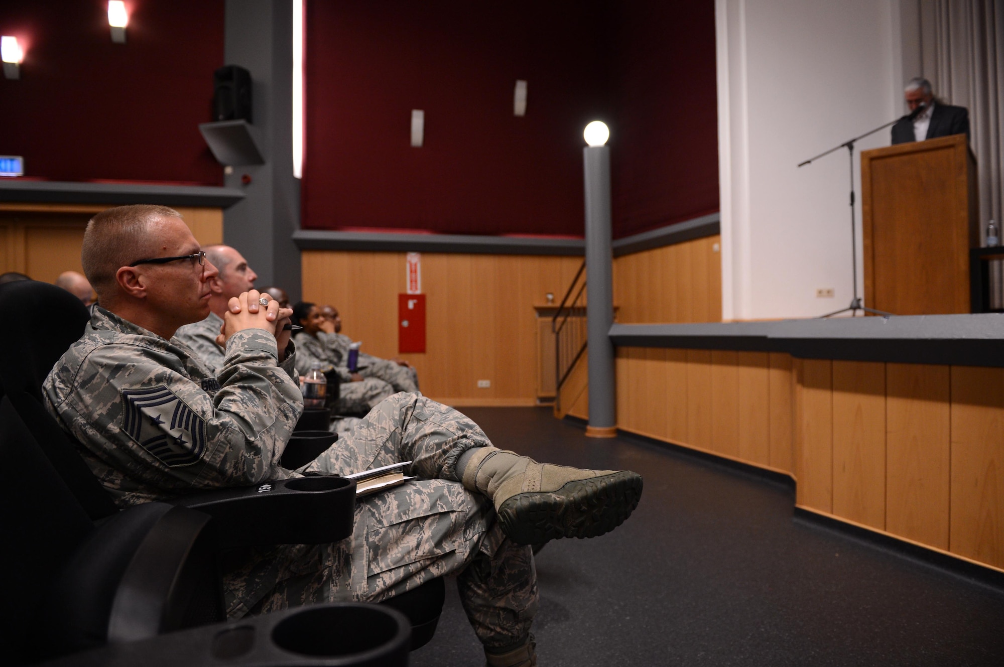 SPANGDAHLEM AIR BASE, Germany – U.S. Air Force Chief Master Sgt. Matthew Grengs, 52nd Fighter Wing command chief, listens to University of Oklahoma Department of Human Relations Professor Tim Davidson’s leadership seminar at the base theater Oct. 24, 2013. Airmen and civilians attended Davidson’s presentation about problem solving and leadership development. (U.S. Air Force photo by Airman 1st Class Kyle Gese/Released)