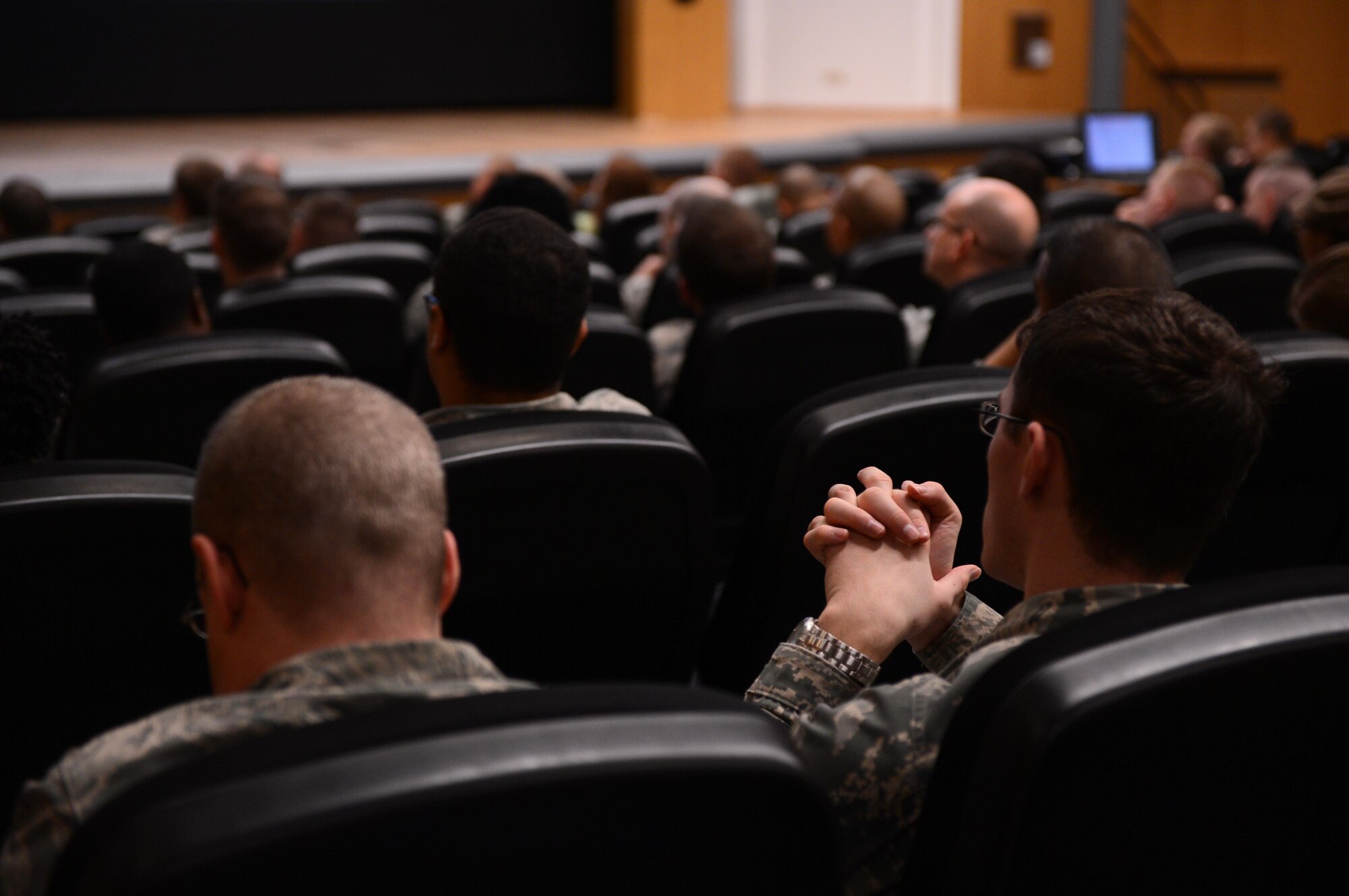 SPANGDAHLEM AIR BASE, Germany – U.S. Air Force Airmen listen to University of Oklahoma Department of Human Relations Professor Tim Davidson’s leadership seminar at the base theater Oct. 24, 2013. Davidson gave a two-hour leadership presentation to help Sabers develop cognitive thinking, mentorship ability and problem-solving skills. (U.S. Air Force photo by Airman 1st Class Kyle Gese/Released)