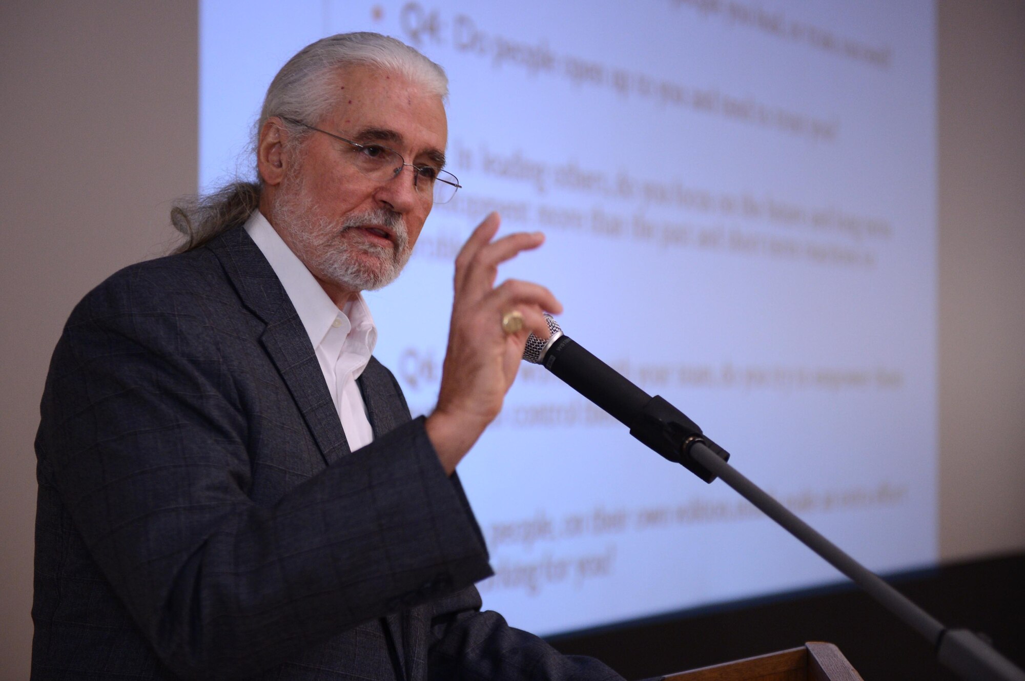 SPANGDAHLEM AIR BASE, Germany – University of Oklahoma Department of Human Relations Professor Tim Davidson talks to Airmen about his STRENGTH Model of Leadership at the base theater Oct. 24, 2013. Davidson’s model focuses on themes that can help people become better leaders and role models. (U.S. Air Force photo by Airman 1st Class Kyle Gese/Released)
