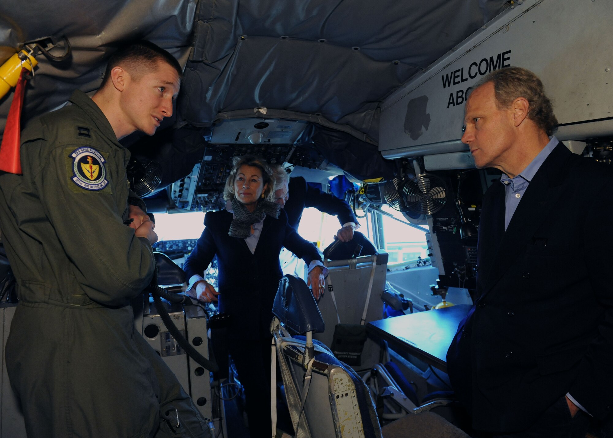U.S. Air Force Capt. Bruce Jamison, left, 351st Air Refueling Squadron pilot, gives information about a KC-135 Stratotanker to The Honorable James Buxton, right, High Sheriff of Cambridgeshire, and Lady Sarah Leicester, High Sheriff of Norfolk, Oct. 23, 2013, on RAF Mildenhall, England. Local high sheriffs toured the base to learn more about its mission and how it affects the local community. (U.S. Air Force photo by Airman 1st Class Preston Webb/Released)